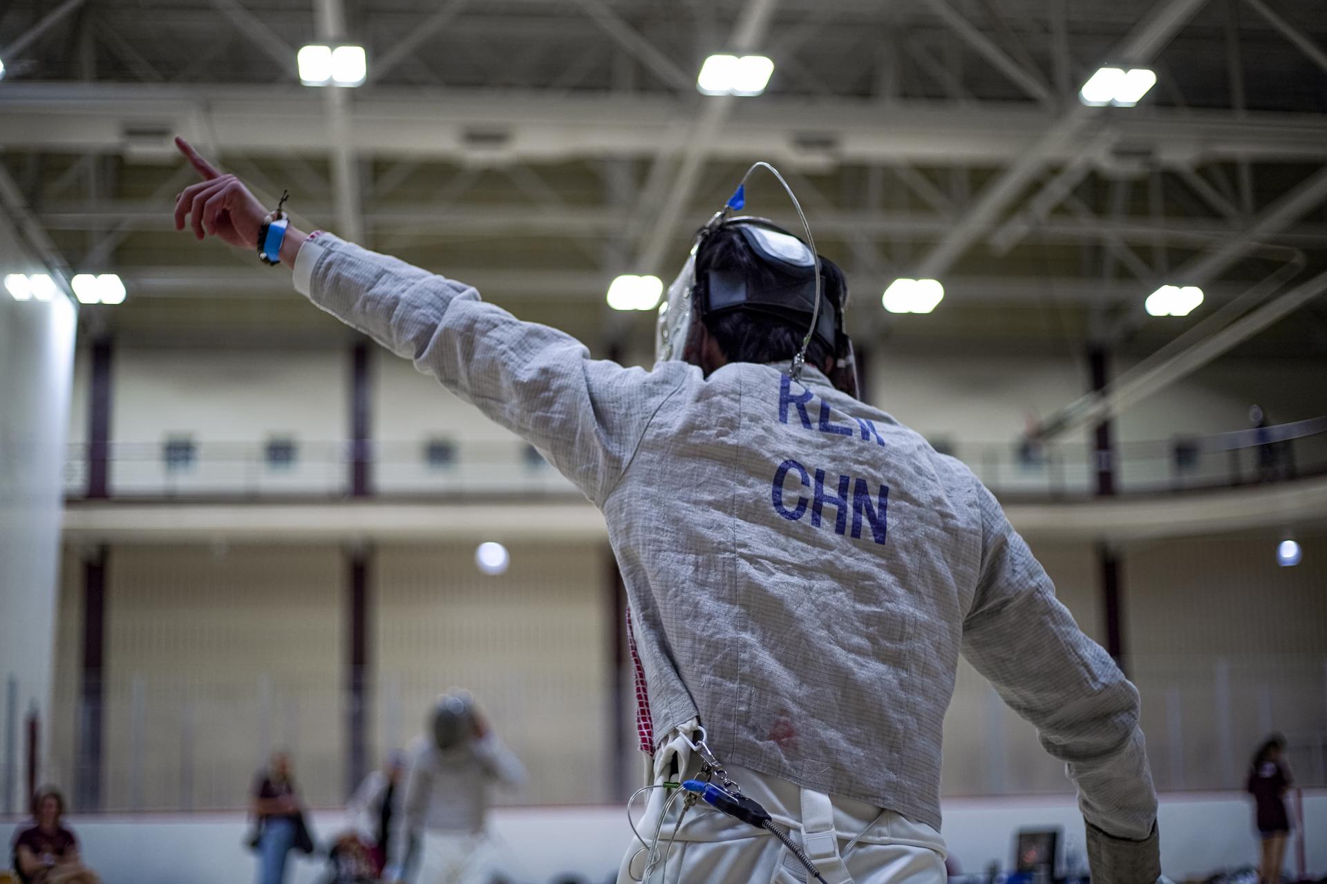 A saber fencer on the piste